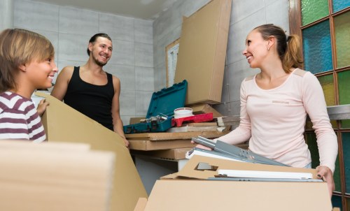 Professional packers preparing moving boxes in a Waterloo home