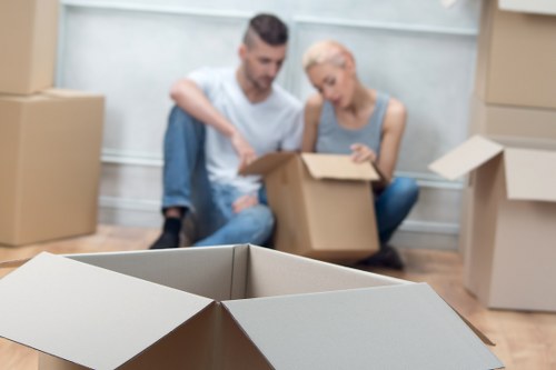 Removal team supporting a local move in Waterloo with boxes and furniture