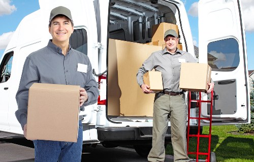 Local packing team organizing fragile items for a Waterloo move